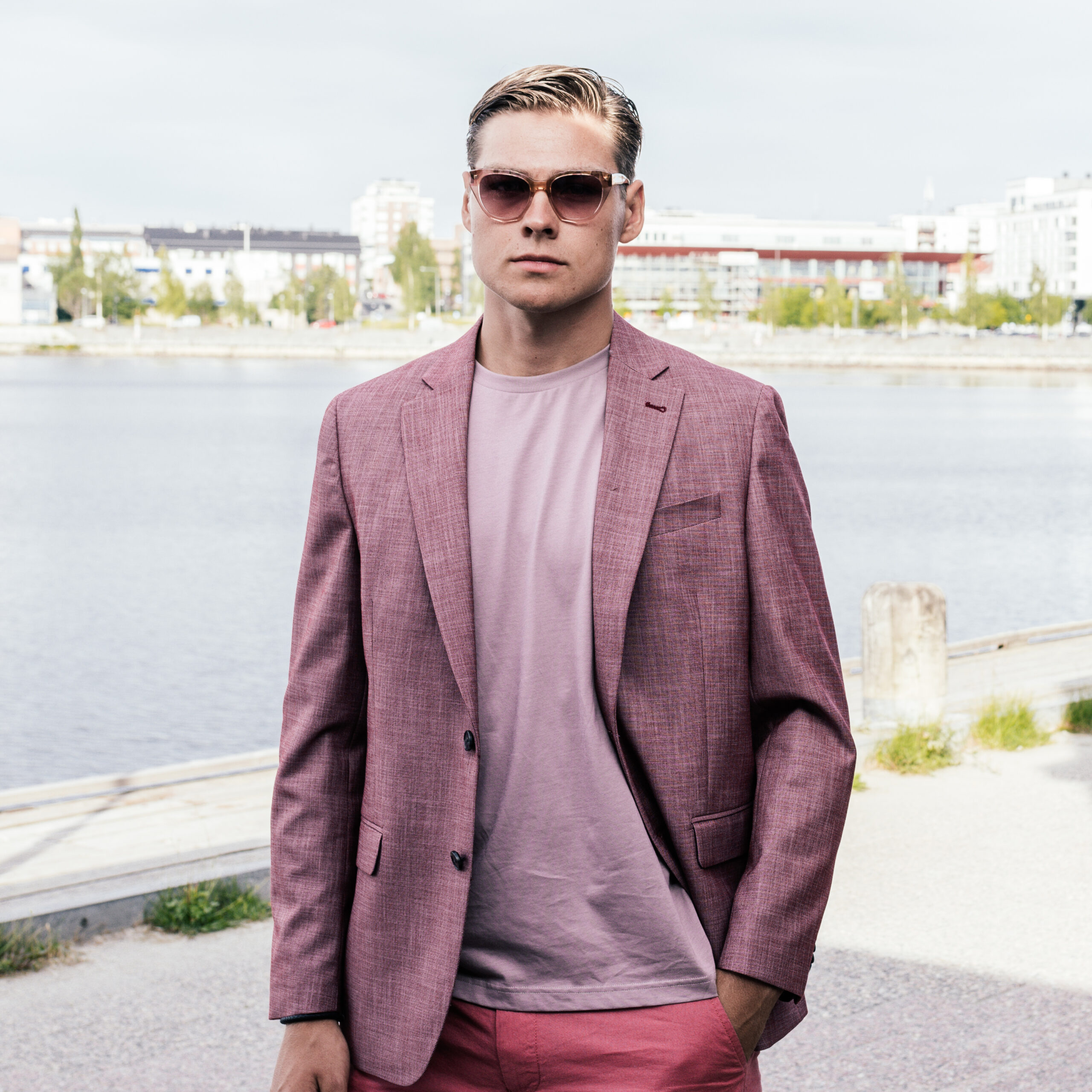 Man wearing sunglasses by the shore