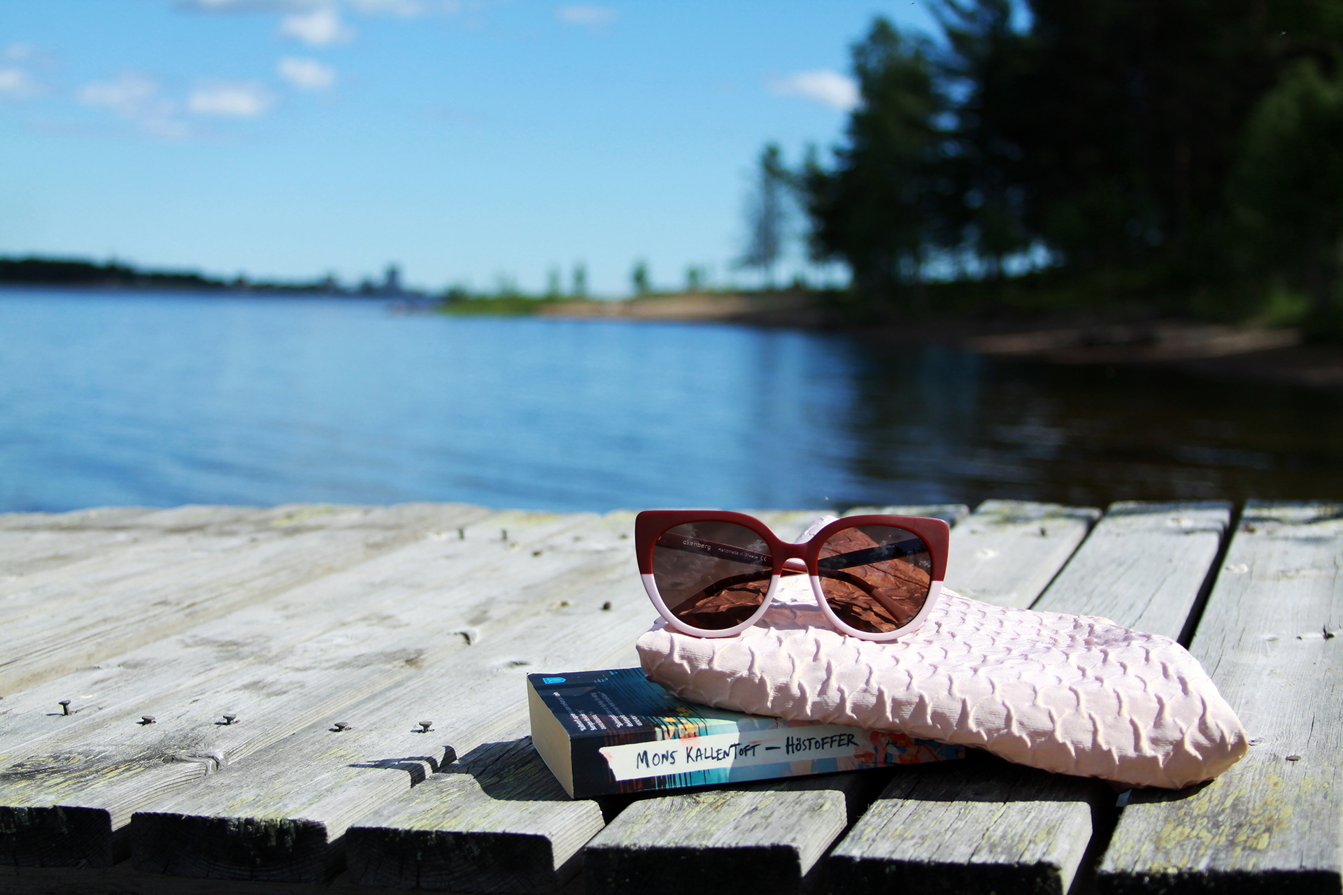 sunglasses on wood deck