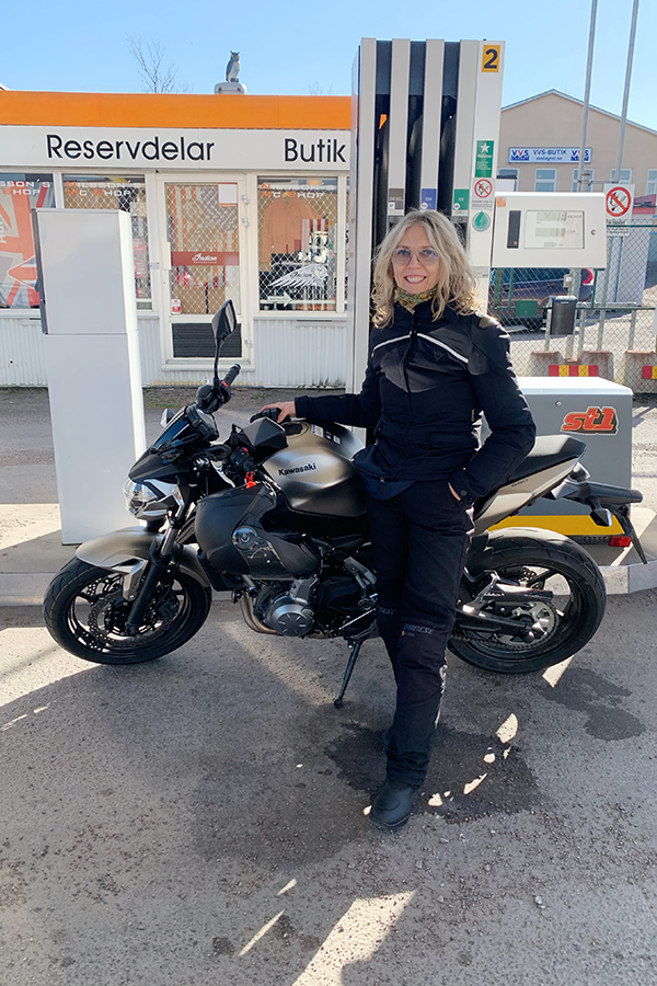 Lotta Ahlvar by her motorcycle