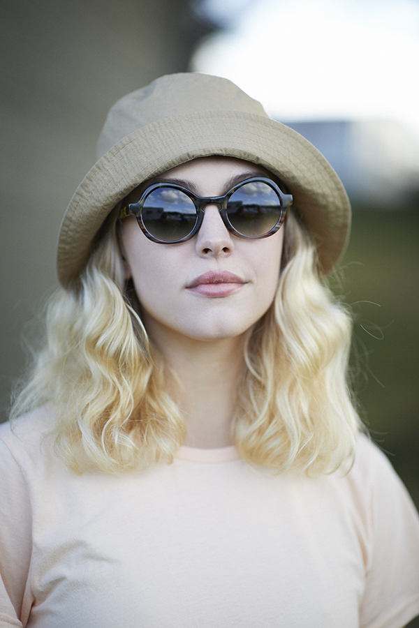 woman wearing a hat and sunglasses