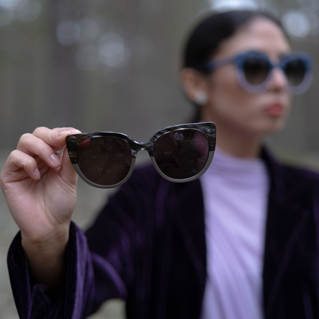 woman and sunglasses in forest